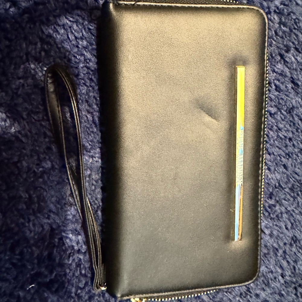 Steve Madden Elegant Black Wristlet with Gold Bar